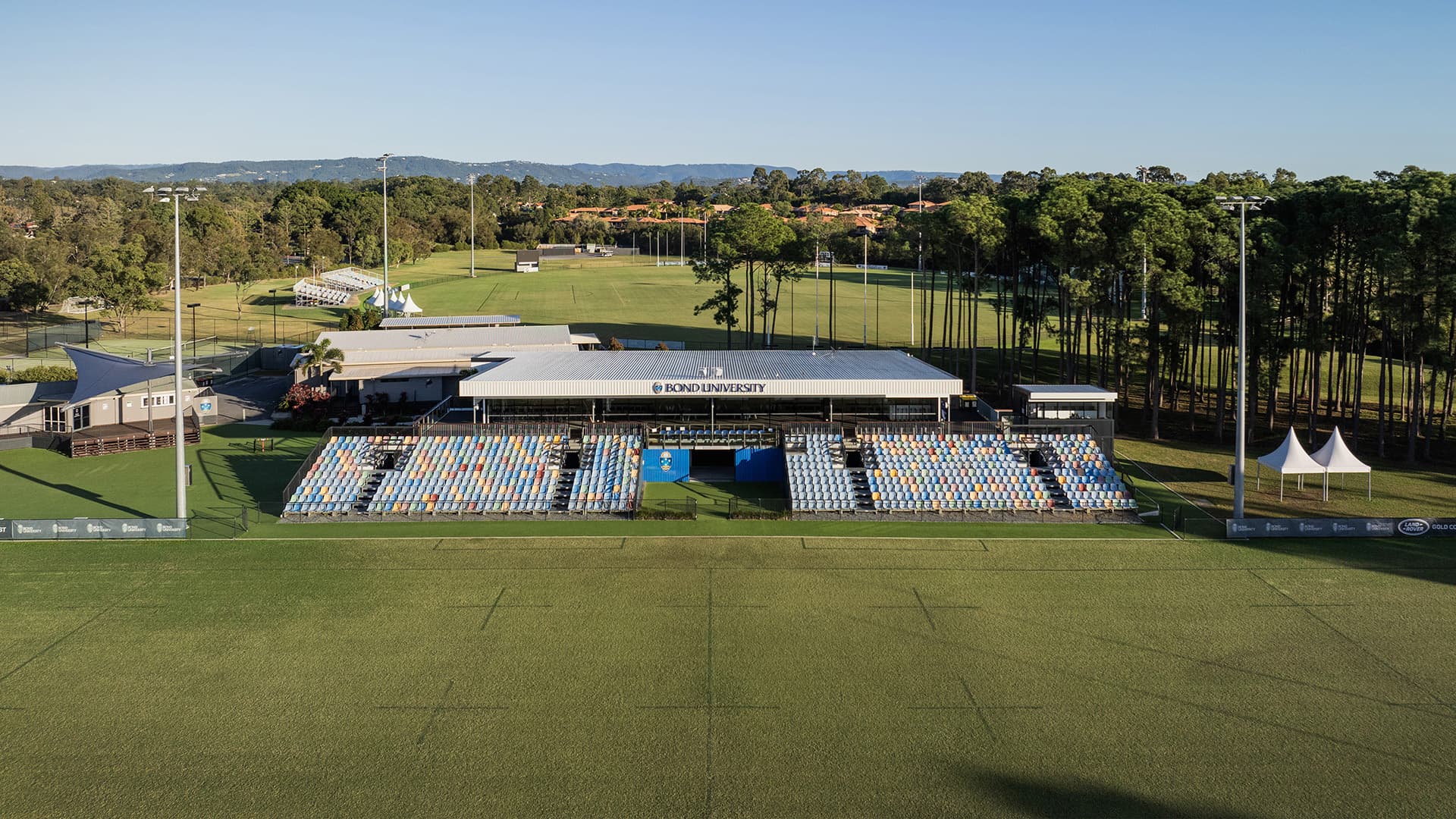 An aerial view of Bond University Rugby field and spectator stands. 