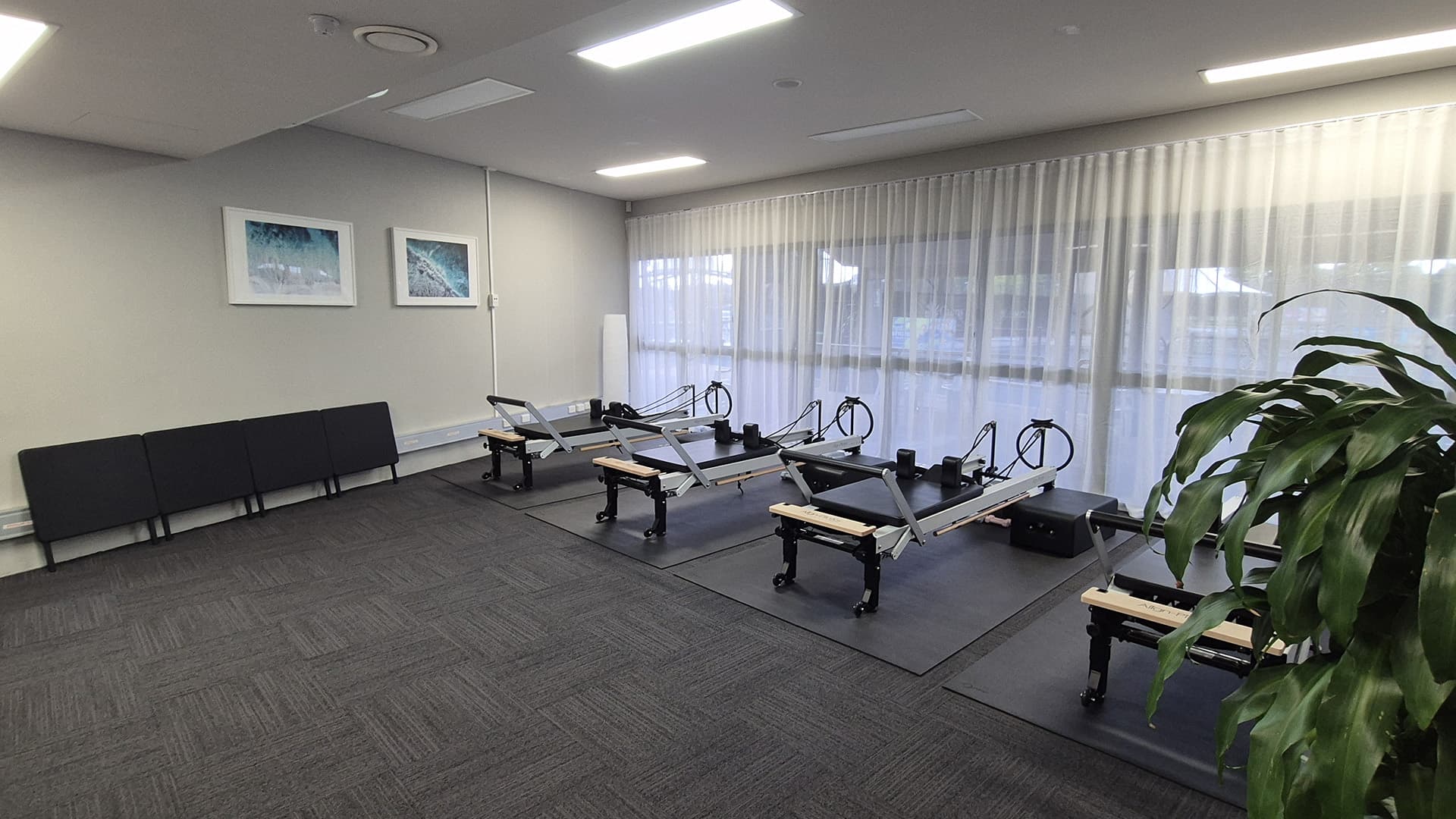 Four pilates machines in a room at Cairns International Tennis Centre.