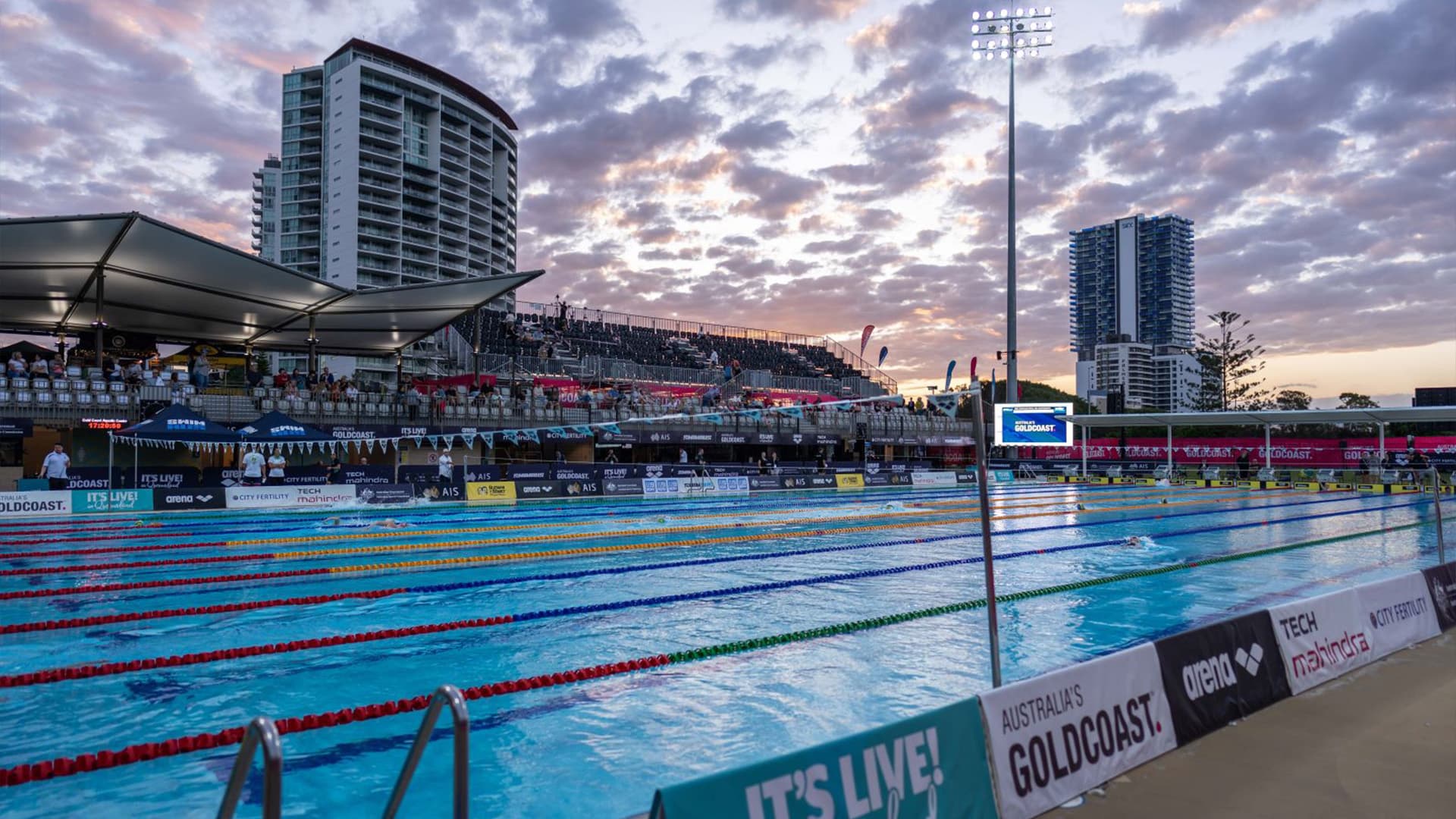 Photo of the swimming pool at the Gold Coast Aquatic Centre at sunset.