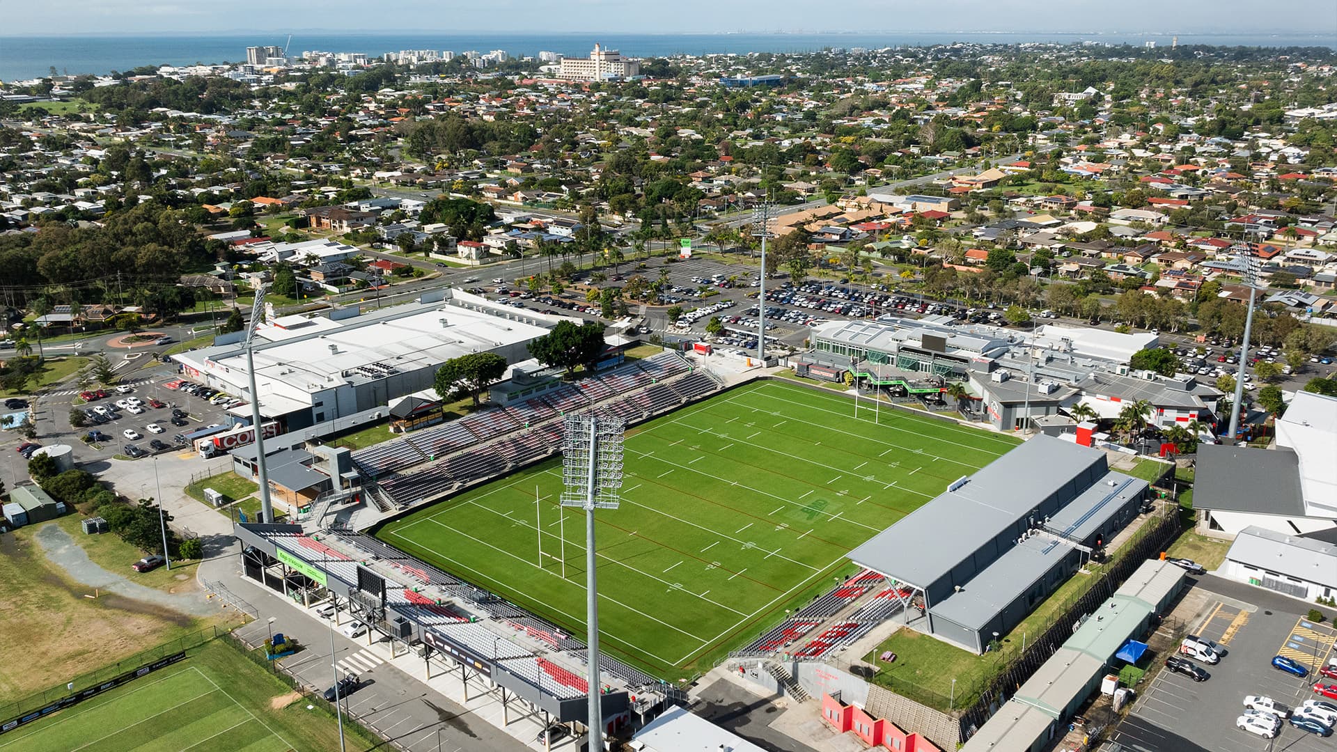 An aerial view of Kayo Stadium during the day with empty stands and no players on the field.