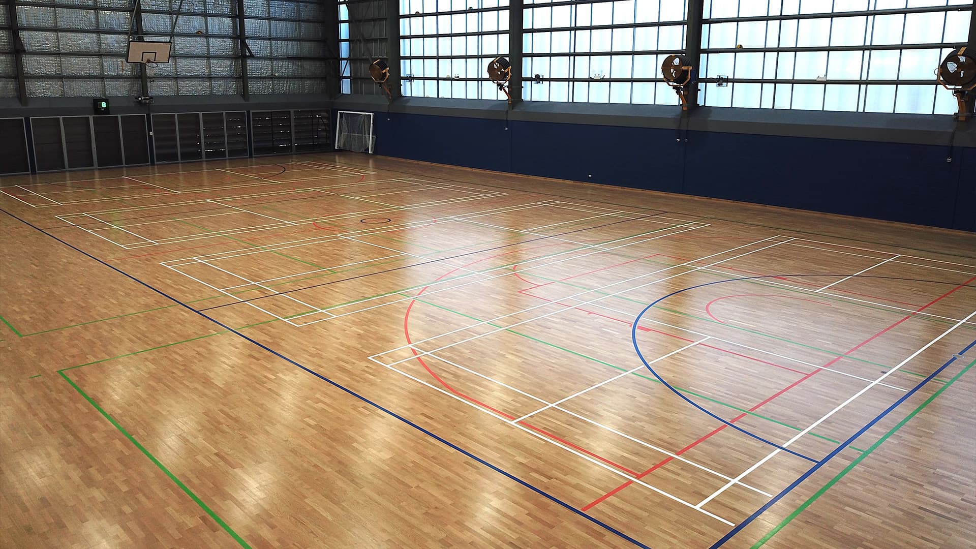 Wide shot of an empty indoor sports court at QUT Kelvin Grove. 