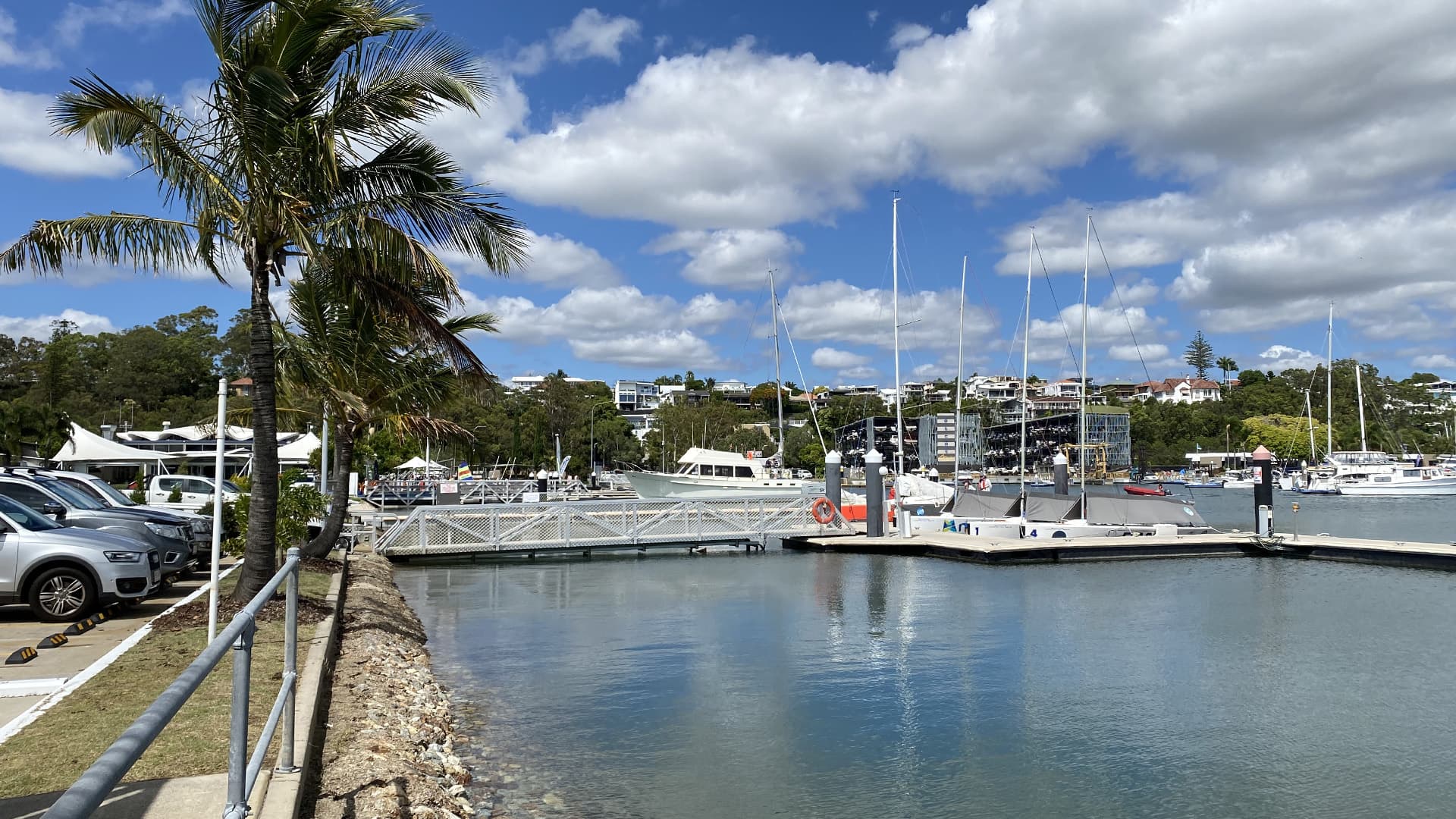 Small sailboats docked near the Royal Queensland Yacht Squadron.