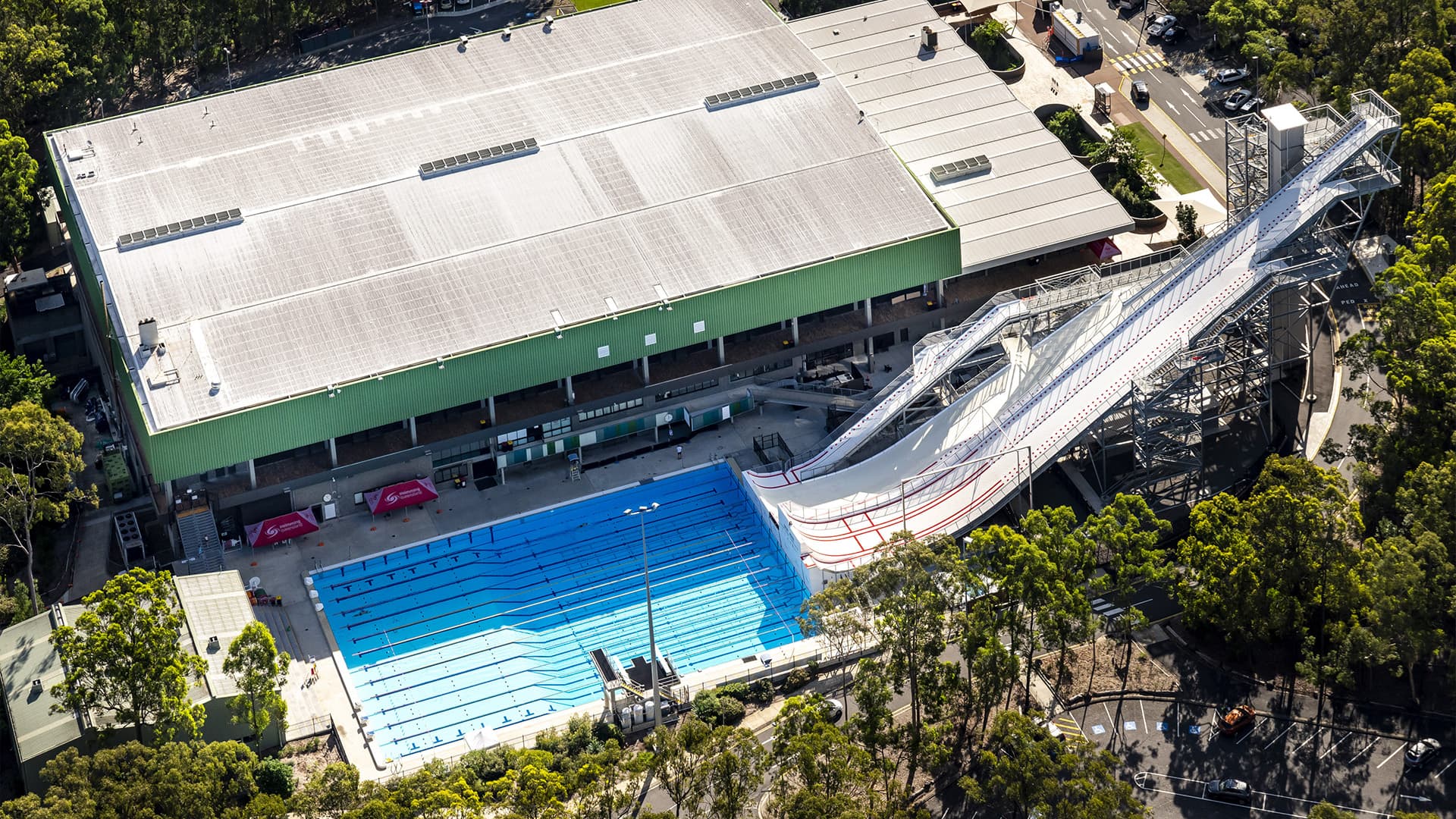 Sleeman Sports Complex water slide going into an large swimming pool. 