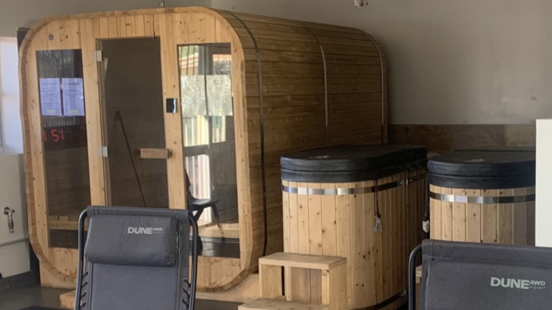 Wooden sauna and cold plunge pools at the Thunder Barball gym.