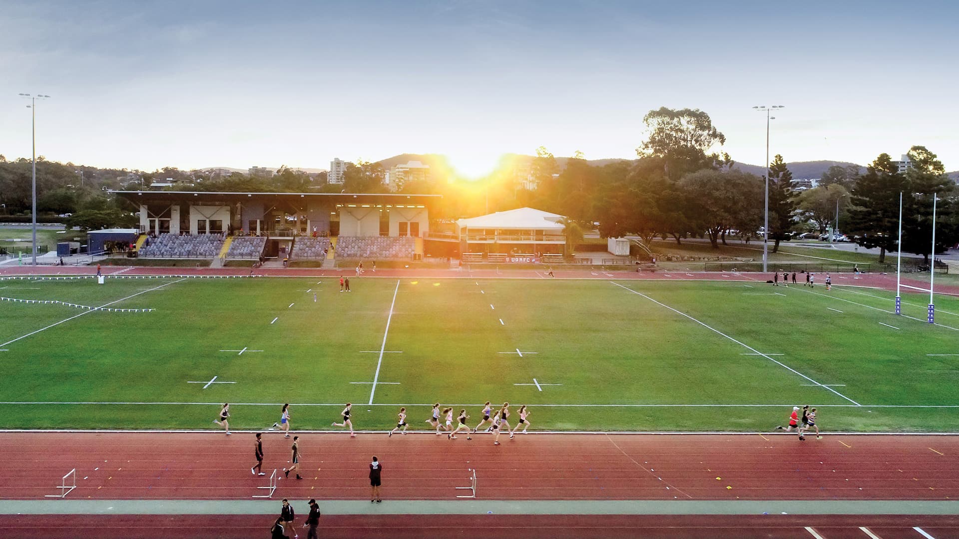 Looking across the sports fields at the University of Queensland into a sunset.